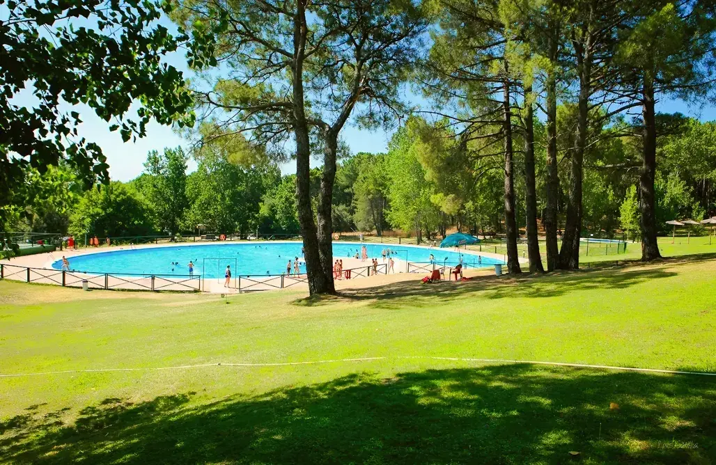 Beachfront resort and campsite with pools and landscaped grounds